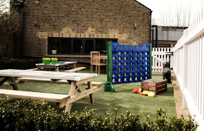 Garden bar and children's play area at The Half Moon pub Herne Hill London