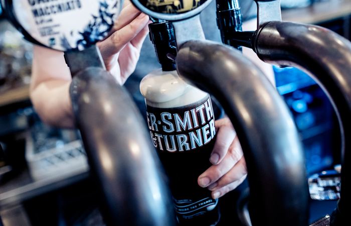Brewer making beer from scratch
