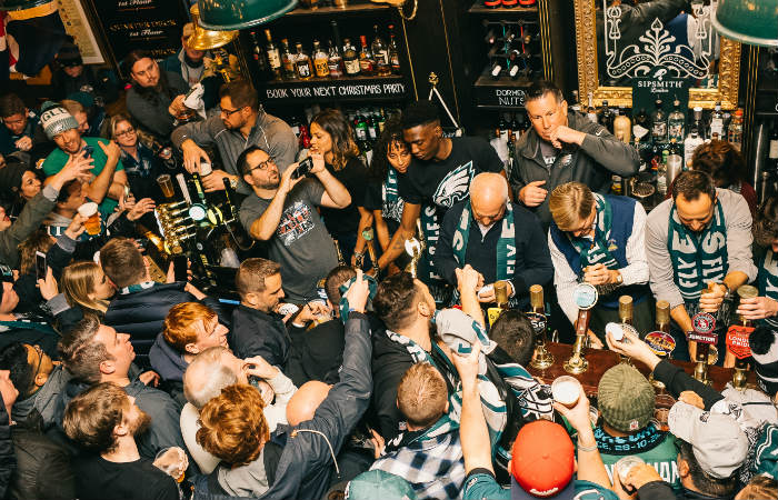 crowd in fullers pub for nfl in london