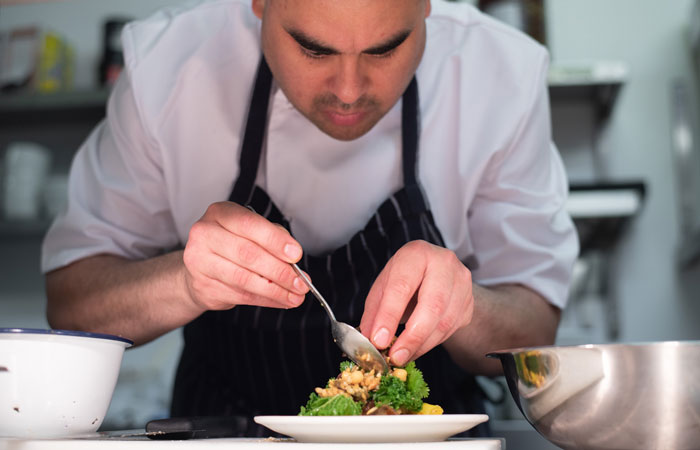 Chef cooking at The Old Bank bar and restaurant on Northcote Road in Battersea
