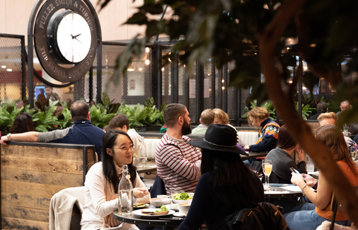 People dining at The Signal Box pub Euston station